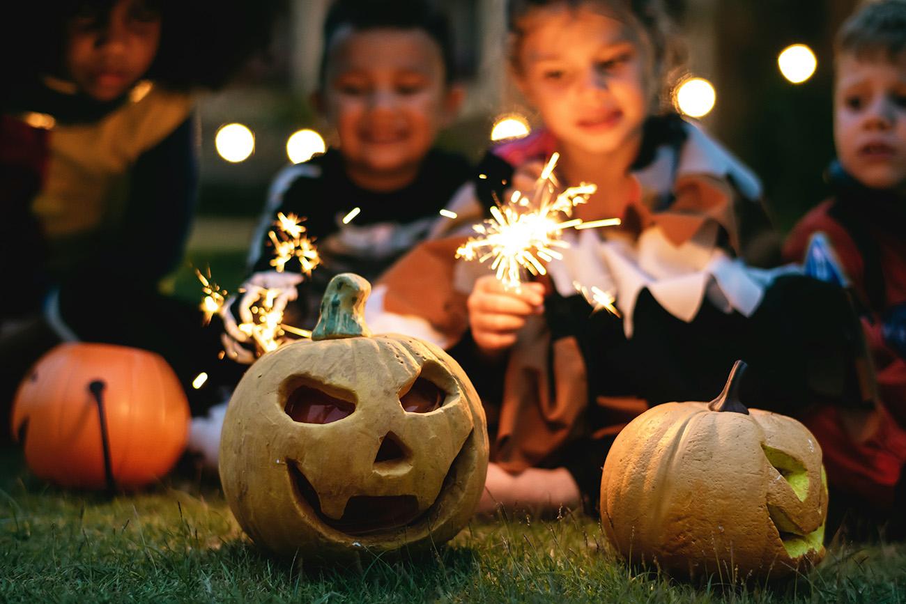 Children with pumpkins and sparklers
