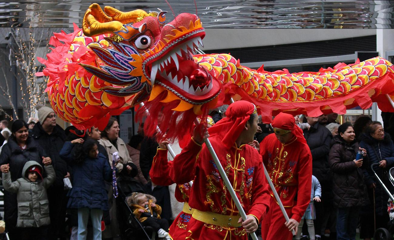 A parade with a traditional Chinese dragon