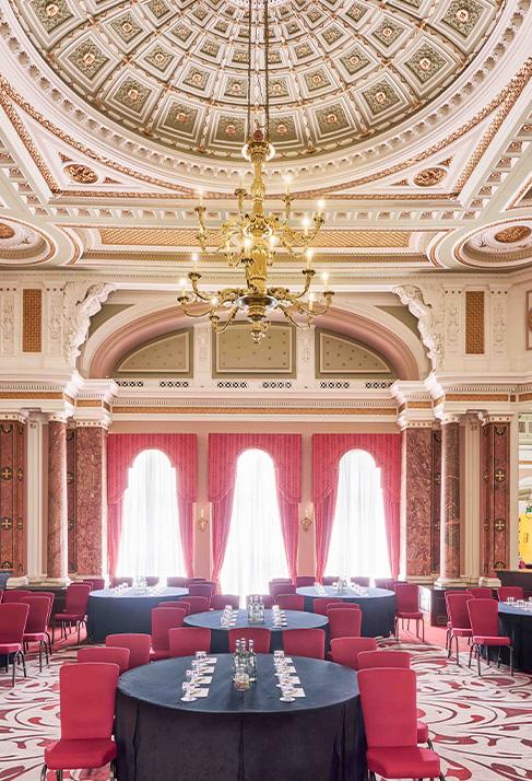 Clermont Charing Cross - Ballroom Cabaret - Large meeting room with round tables.